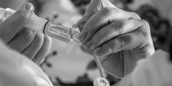 This photo is of a mother holding a syringe.