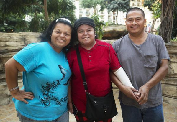 This picture is of a smiling family at the 2018 debra Care Conference (DCC).