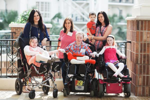 This photo is of 3 mothers and their children with Epidermolysis Bullosa (EB).